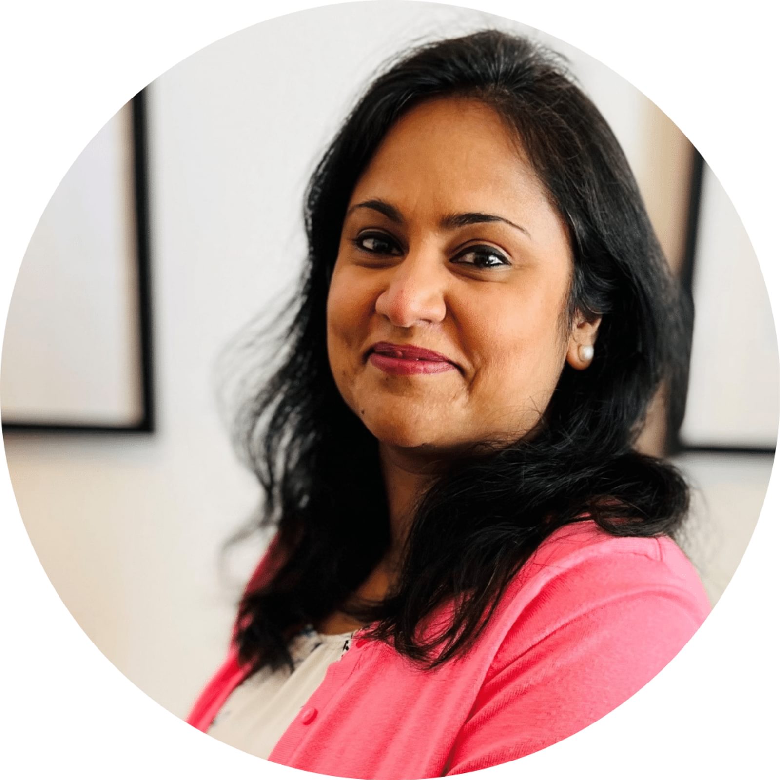 Anjali Sinha's headshot in circular frame