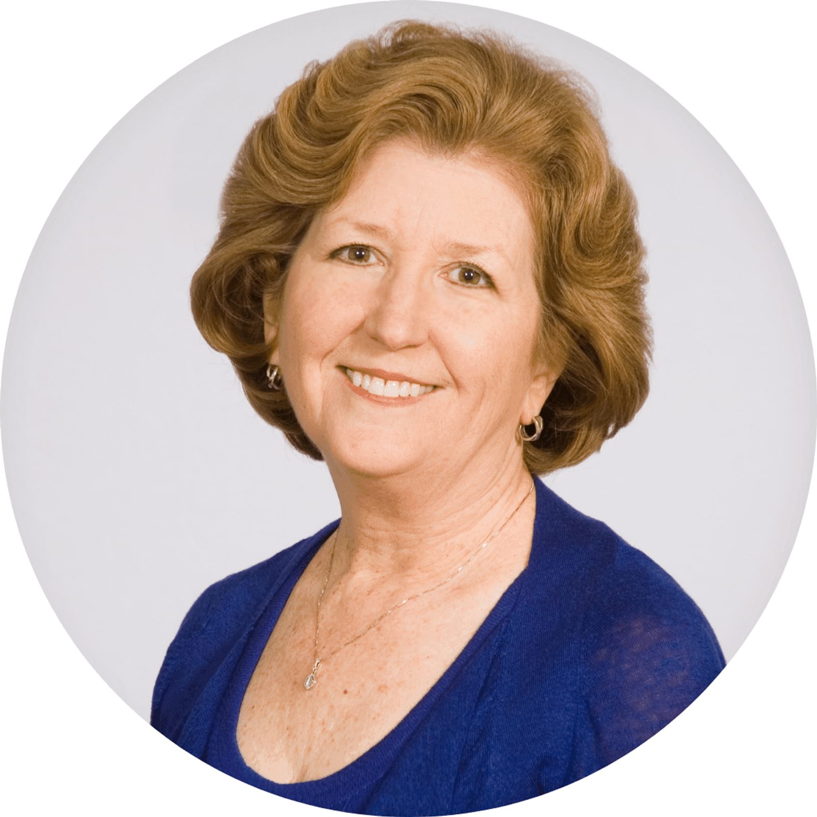 Mary Beth Barrett-Newman's headshot in circular frame