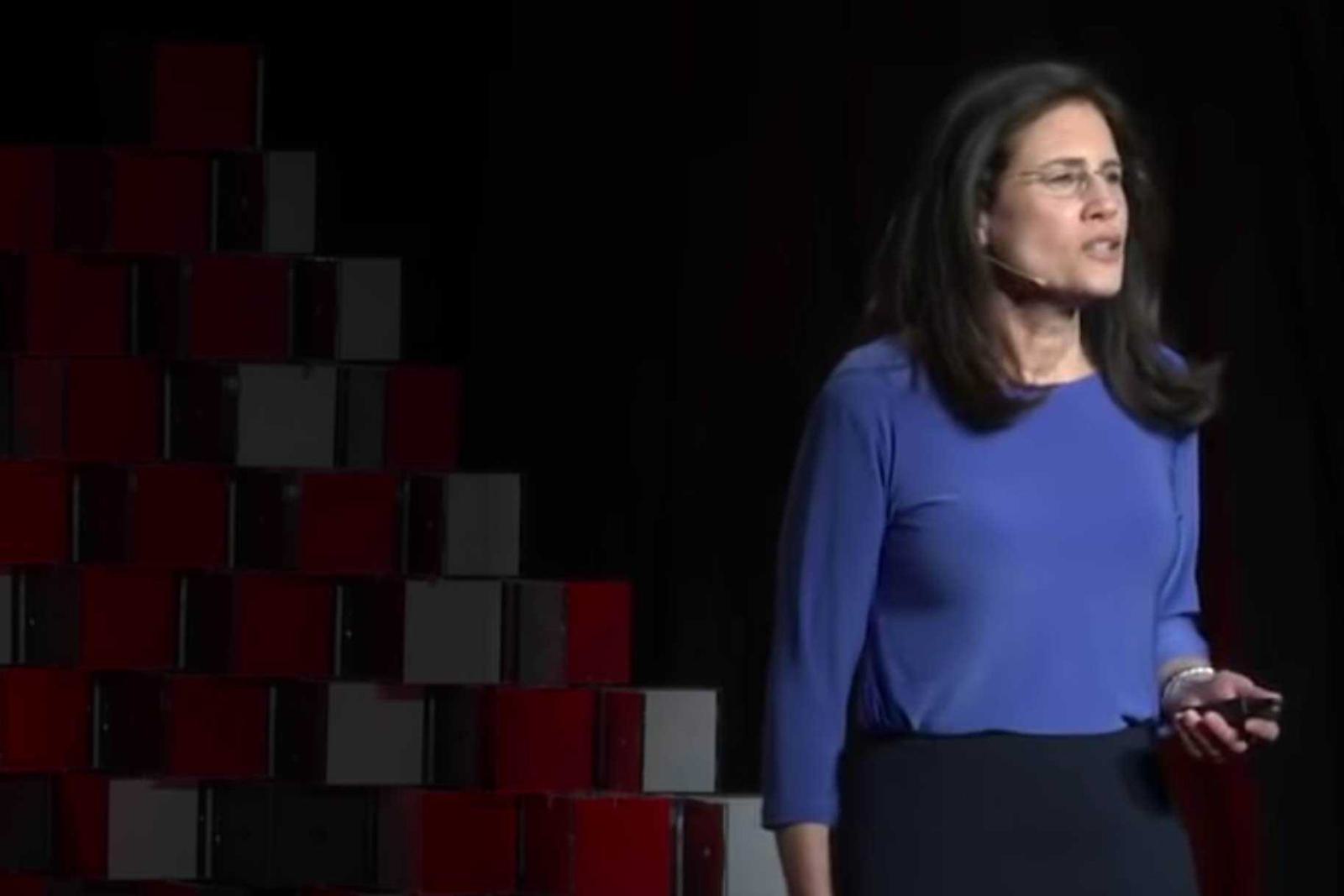 A photo of Carol Fishman Cohen delivering her TED Talk presentation