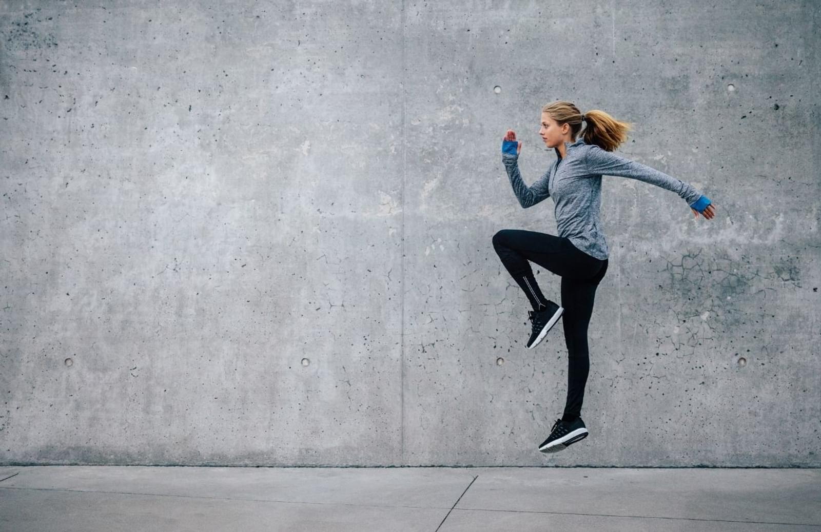 Woman jumping while exercising